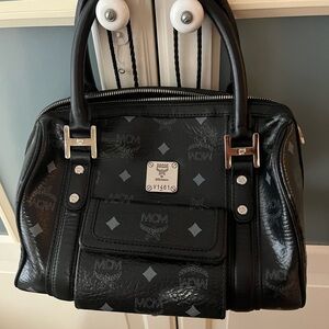 MCM color black, 10”x8” in length, excellent condition, leather